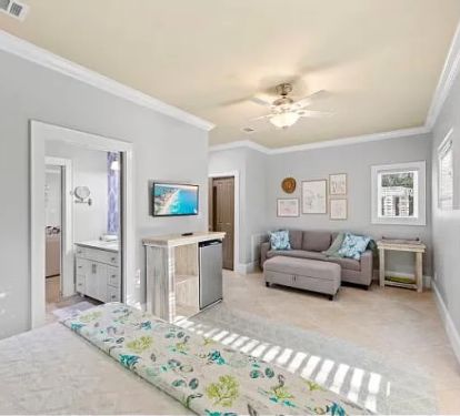 Ground floor suite with bathroom and siting area. Beverage fridges in bedrooms