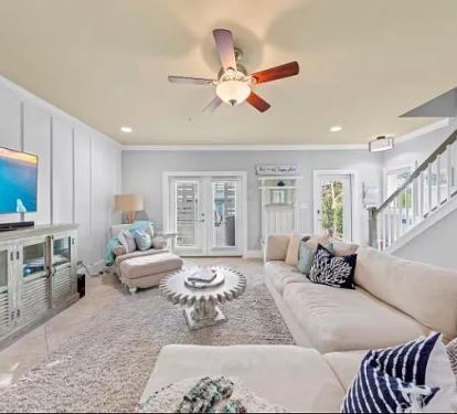 A ground floor Famliy space with sectional, TV and table top arcade. 
