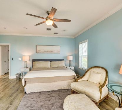 Large bedroom with comfy seating.
