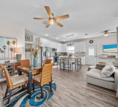 Dining table with 4 chairs and a fan