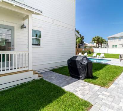 Side yard with gas grill