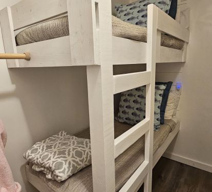 Rear bunkroom. Both bunks have power outlets and cubbyholes.