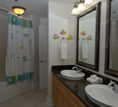 The third bath with double sinks is shared between bedrooms three and four!