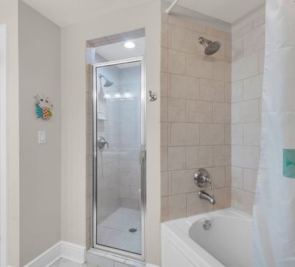 Our third bath has a tub and a separate walk in shower!