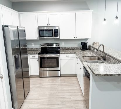 Stainless Steel Appliances and Fully Stocked Kitchen 