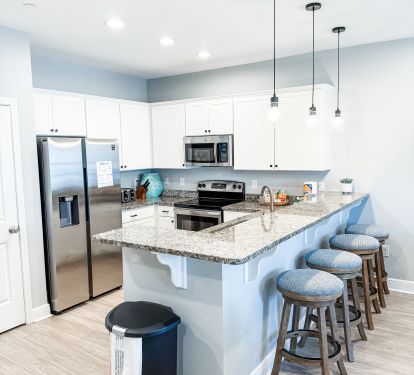 Stainless Steel Appliance and Fully Stocked Kitchen