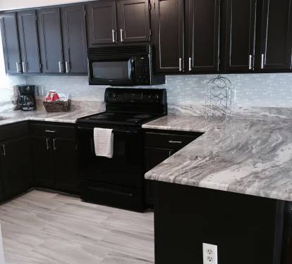 Spacious kitchen. Stocked with appliances and kitchen utensils