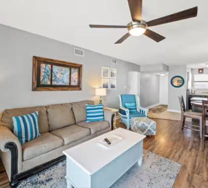 Beachy vibe and beachy colors in the living room and throughout the condo.