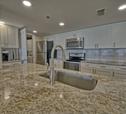 New cabinets, backsplash, cabinets, tile flooring, dishes, cooking utensils