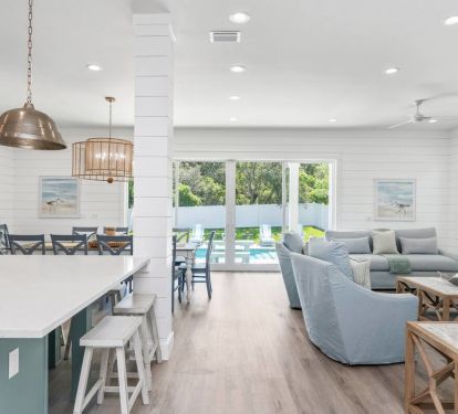 Enjoy Encore's panoramic pool view from the living, dining and kitchen.