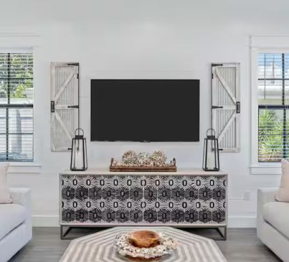 Two different living rooms offers a blend of style and comfort in its seating arrangements.