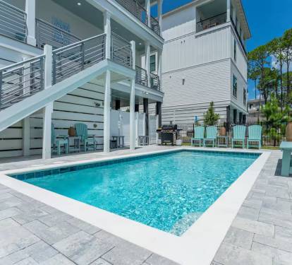 Plenty of designer grade outdoor seating by the pool for everyone to enjoy!