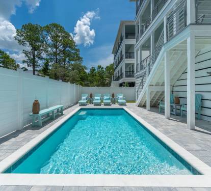 Plenty of designer grade outdoor seating by the pool for everyone to enjoy!