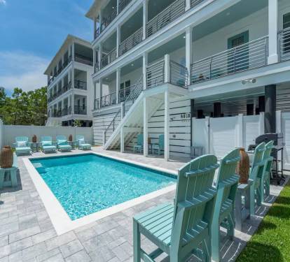 Plenty of designer grade outdoor seating by the pool for everyone to enjoy!