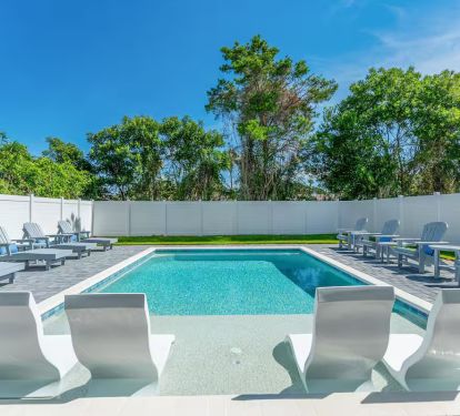private pool with spacious, fully fenced back yard