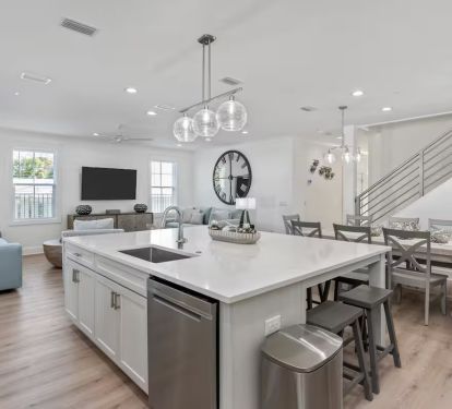 With 10 dining table seats and 5 additional stools at the kitchen island
