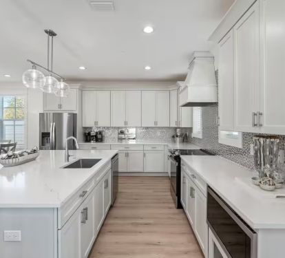 quartz counter tops and stainless steel appliances