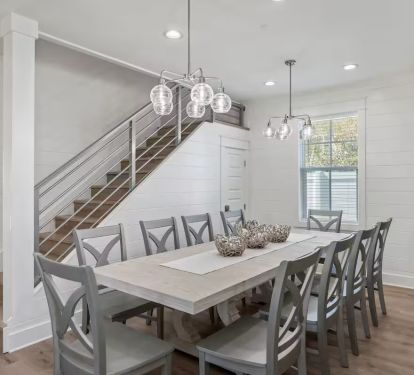 With 10 dining table seats and 5 additional stools at the kitchen island