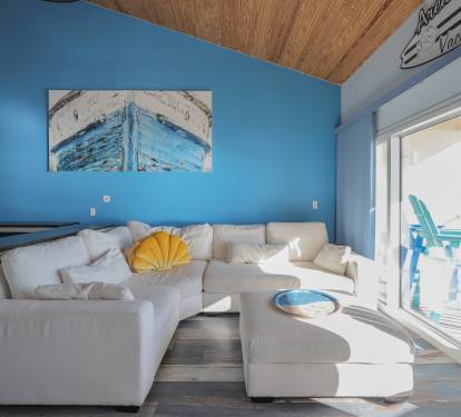 Step into a bold, designer living room where vibrant color meets luxury.