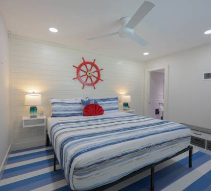 Master bedroom with a comfortable king bed.