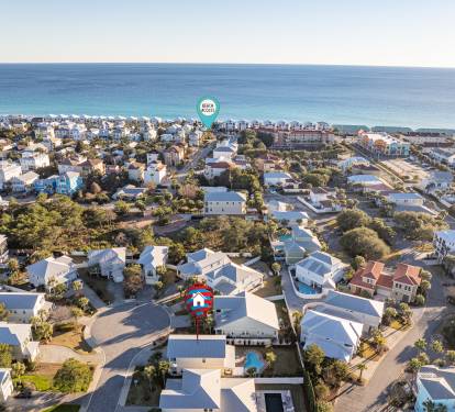 Aerial overview of the neighborhood highlighting Aqua Reina and the nearby public beach access.