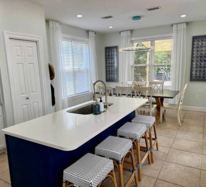 Ample space for seating near kitchen island along with dining table