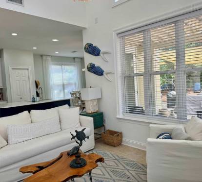 Comfortable couch and 2 easy chairs. Barstools can easily be used as additional seating.