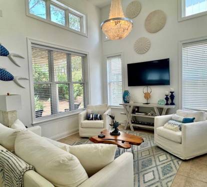 Making a snack or fixing a drink? You are not missing anything in this kitchen open to living and dining