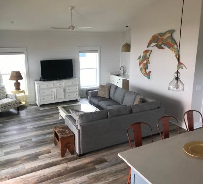 Large upper living room with custom wall art