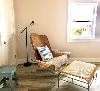 Enjoy a book or a nap in this wicker wing chair