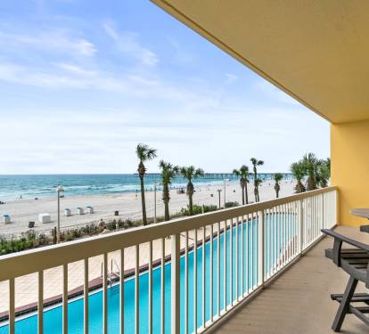 Large balcony overlooking the pool and beach