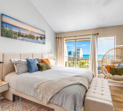 Recharge in the Master king suite with sunset vibes, touch lamps + USB, and pool-to-beach views.