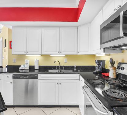 Fully equipped kitchen with modern appliances, perfect for home cooking.