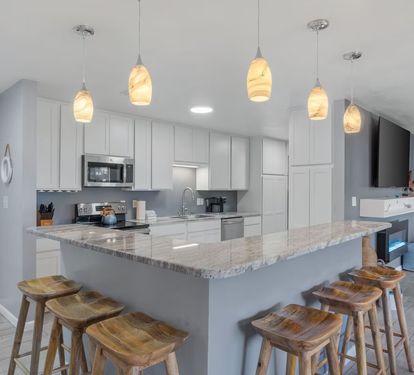 Open kitchen space with kitchen island seating space