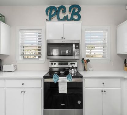 Fully equipped kitchen with modern appliances, perfect for home cooking.