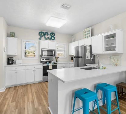 Open kitchen space with kitchen island and seating space