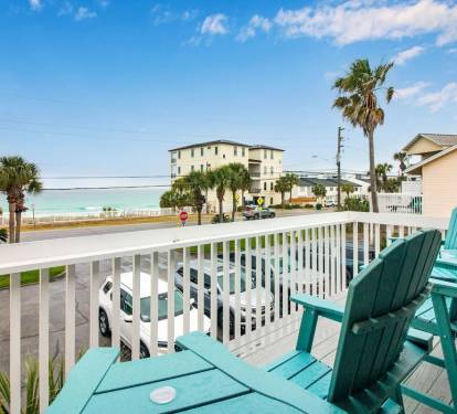 Relax in our elevated polywood chairs on the balcony after a day at the beach.