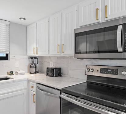 Fully equipped kitchen with modern appliances, perfect for home cooking.