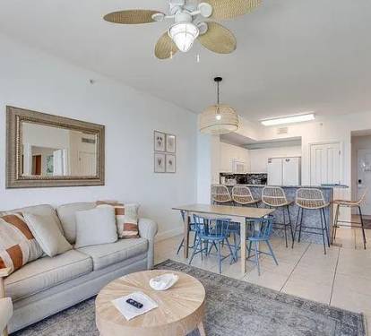Spacious living, dining, and bar area&mdash;bright coastal design perfect for gatherings