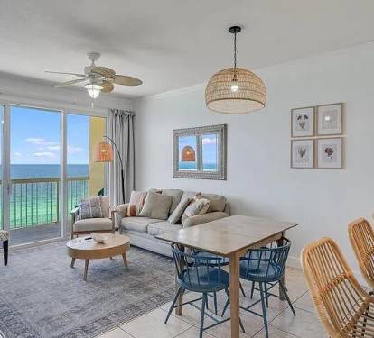 Bright coastal living room with turquoise Gulf views&mdash;relax and soak in paradise