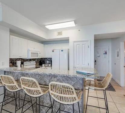 Modern kitchen with marble bar seating-bright stylish and perfect for gatherings