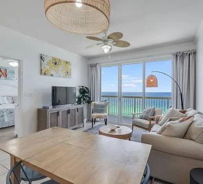 Open living room with bedroom and balcony access&mdash;bright space and stunning views