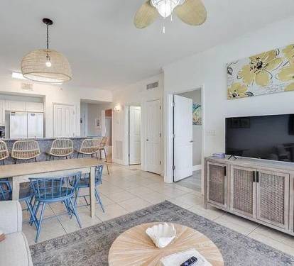 Relaxed living, dining, and bar area&mdash;coastal comfort with bright, inviting style