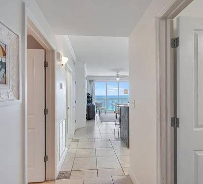 Inviting entryway leading to bright turquoise Gulf-views from the living space