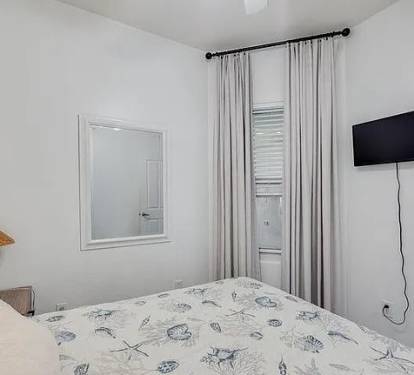 Cozy guest bedroom with hotelâ€‘quality mattress&mdash;rest easy in coastal comfort
