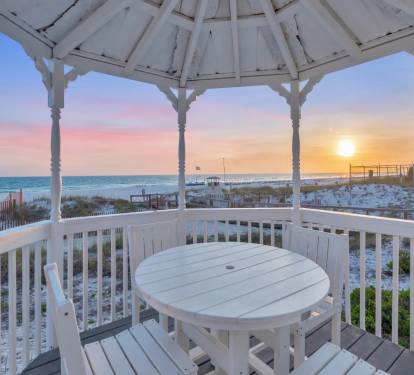 Charming beachside retreat featuring expansive outdoor spaces and direct sand access.