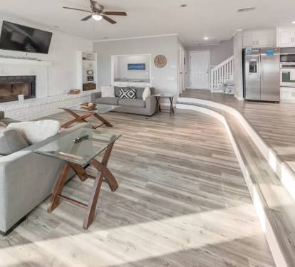 Spacious open-concept living area with modern coastal d&eacute;cor.