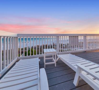 Unwind with sunset views from the rooftop lounge chairs.