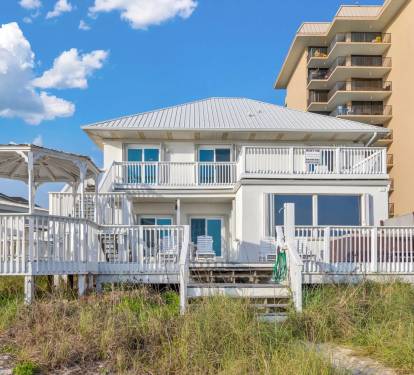 Spacious beachfront home with stunning decks, perfect for your coastal getaway.