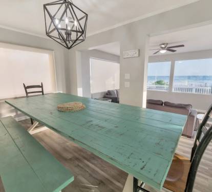 Rustic-style dining table with plenty of natural light and coastal charm.